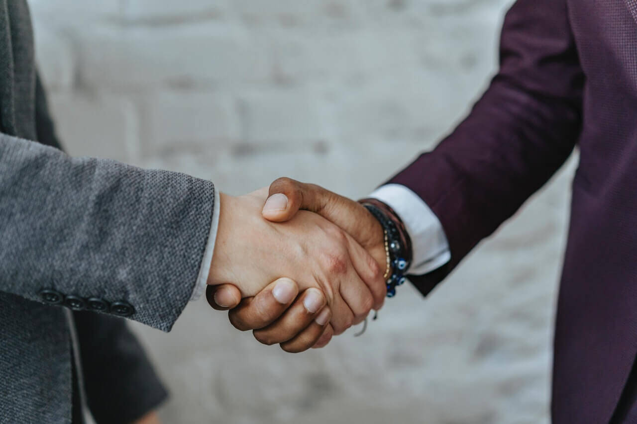 Client shaking hands with an attorney